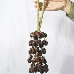 Hochet durable BURAHOL Seed Pod ~ Shaker musical fait à la main d'Indonésie avec d'autres matériaux - Product Image 1