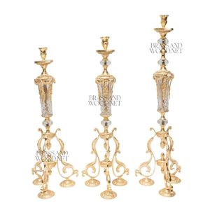Juego de candelabros de latón dorado con acentos de cristal, bases ornamentadas y lujoso diseño decorativo clásico - Product Image 1