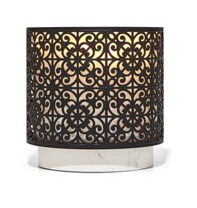 Portavelas de metal con acabado antiguo para agregar encanto y carácter a la decoración de su comedor o sala de estar - Product Image 3