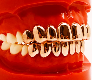 ใหม่Hip Hop Gold PlatedฟันGrillzสําหรับฟันFineด้านบนด้านล่างฟันกลวงย่างทันตกรรมสําหรับUnisexเครื่องประดับพรรคของขวัญ - Product Image 1