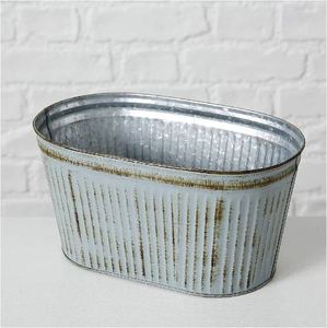 Conjunto de tres macetas de metal, cada una con un diseño texturizado que se asemeja a hojas o escamas superpuestas, en tres patas en forma de V. - Product Image 5