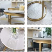 Table d'appoint ronde en métal noir doré avec plateau en céramique à texture marbrée pour salon