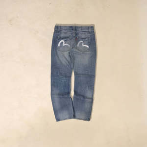 กางเกงยีนส์ Evisu 2013 ทรง Baggy Fit วินเทจ สไตล์โกธิคสำหรับฤดูหนาว ทรงตรง พร้อมลายปักสัตว์แบบ Patchwork ผ้าเดนิมถัก - Product Image 1