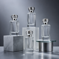 Botella de Perfume de Vidrio Cilíndrica de Lujo Directo de Fábrica, Nuevo Diseño con Tapa en Forma de Corona, 50ml 75ml, Presurizada con Pulverizador