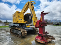 Tracteur forestier sur chenilles CATERPILLAR XT430-5 d'occasion de qualité avec pelle rétrocaveuse et chargeur frontal
