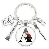 Alphabet de brosse à dents personnalisé porte-clés cabochon pendentif nouveau design assistant dentaire cadeau mode en métal pour les soins dentaires