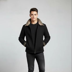 Chaqueta de mezcla de lana negra con un cuello de cuentas elaboradamente bordado, fabricada por la marca Champ King en Pakistán. - Product Image 1