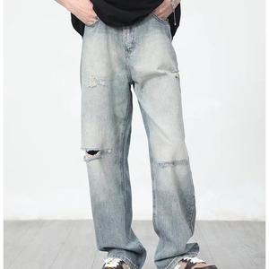 กางเกงยีนส์ผู้ชายทรงเฟลร์แบบวินเทจฟอกสี ขาดเซอร์ๆ สไตล์ดิสเทรส รูขาดๆ คุณภาพดี รับผลิตแบบ OEM ขายส่ง - Product Image 6