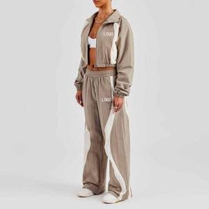 Chándal de mujer con logotipo personalizado, novedad, OEM, mejor servicio, conjunto con cremallera a prueba de viento, venta al por mayor, buena alta calidad para mujer - Product Image 1