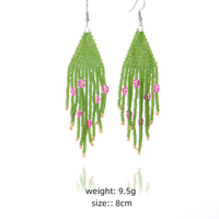 Boucles d'oreilles longues bohèmes en perles de graines, avec un petit pompon fleuri mexicain fait à la main par Lancui