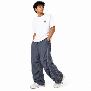 Pantalones anchos tejidos para hombre al por mayor, cintura elástica, ribete lateral reflectante, dobladillo ajustable, pantalones casuales de moda, ropa urbana personalizada - Product Image 1