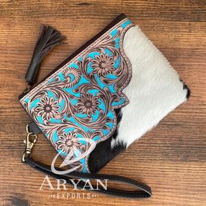 กระเป๋าเครื่องสำอางหนังวัวแบบมีซิปใช้มือใหม่สำหรับผู้หญิงกระเป๋าคลัทช์มีสายคล้องข้อมือหนังแท้มีพู่ - Product Image 1