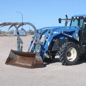 Tracteur HOL LAND TM125 d'occasion, modèle 1051, avec chargeur auto-nivelant 72LA, godet à fixation rapide de 96 pouces avec grappin - Product Image 2