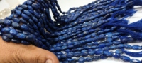 Eminent Jewel - Cuentas de Lapislázuli Azul Natural de Alta Calidad, Forma Ovalada Facetada de 9-10 mm, Tipo Mani, Vendidas por Hilo de 13 Pulgadas