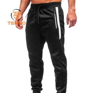 Pantalon de survêtement ample à empiècements pour hommes, logo et taille personnalisés Pantalon de survêtement droit de couleur unie Pantalon de survêtement évasé Bootcut - Product Image 1