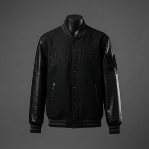 Chaqueta de hombre negra de lana con mangas de cuero y botones a presión, cuello y puños con ribetes, paneles en contraste, estilo casual y urbano, ajuste personalizado. - Product Image 1