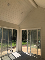 Mini studio de 16 m² en bois, style cabane, avec toit en acier