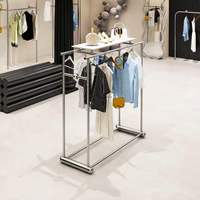 Présentoir à vêtements moderne en acier inoxydable, double rangée, étagère îlot pour rangement de sacs, aménagement personnalisé pour magasins de détail