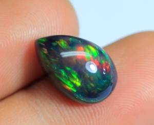 พลอยโอปอลสีดำจากเอธิโอเปียอัญมณีทรงลูกแพร์สีดำประกายสีรุ้งแวววาวทรงอัญมณีทรงหลังเบี้ยโอปอลสีดำจากเอธิโอเปีย - Product Image 2