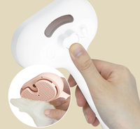 Brosse à vapeur autonettoyante pour le toilettage des poils d'animaux.
