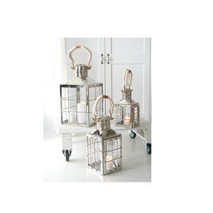 Polished Stainless Steel Lantern With <b>Candle</b> <b>Holder</b> Perfect For Indoor And <b>Outdoor</b> Use During Parties And Family Celebrations - Product Image 1
