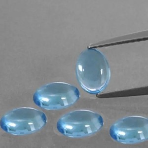 8mm 10mm naturel suisse bleu topaze lisse ovale en gros cabochon en vrac boutique en ligne du fournisseur meilleur prix d'usine Alibaba 2025 - Product Image 1