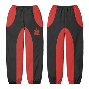 Pantalón Cortavientos de Algodón Premium, 100 GSM, Negro con Paneles en Rojo, Puños con Logotipo Personalizado Serigrafiado, Corte Ligero, Reversible - Product Image 1