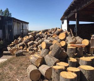 Stacked Hardwood Firewood <b>Logs</b> Ready for Use Outdoor Storage - Product Image 1