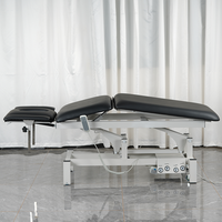 Lit de salon de beauté médical gris noir de luxe 3 moteurs Table de massage électrique lit cosmétique facial moderne à vendre