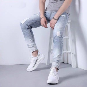 กางเกงยีนส์แฟชั่นสำหรับผู้ชายกางเกงยีนส์แนวสตรีทแฟชั่นสำหรับผู้ชายดีไซน์เข้ารูปและมีรูสำหรับผู้หญิง - Product Image 5