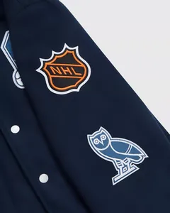 แจ็คเก็ตวาร์ซิตี้แบบกระดุมแป๊กสีน้ำเงิน OVO ของทีม Toronto Leafs สำหรับผู้ชาย แบบสั่งทำพิเศษ - Product Image 5