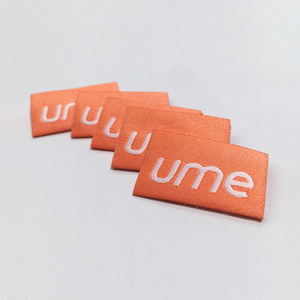 Trung tâm tùy chỉnh gấp quần áo màu cam HEM dệt bên ngoài thẻ logo vải cho may mặc - Product Image 3