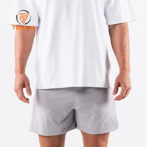 T-Shirt de luxe pour hommes 100% coton 220gsm surdimensionné Boxy Fit goutte épaule faux col rond léger respirant Jersey solide motif avant - Product Image 5