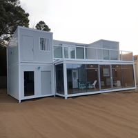 Maison de bureau préfabriquée modulaire de luxe à deux étages avec mur en verre et terrasse
