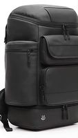 Mochilas universitarias unisex con logotipo personalizado, mochila impermeable negra de moda suave caliente con forro de cuero genuino y cierre de cremallera