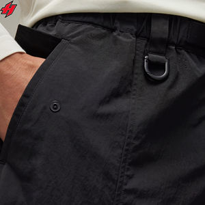 Pantalones impermeables de poliéster OEM para mujer, pantalones de nailon laterales con ambos bolsillos, cintura elástica, pantalones deportivos, pantalones cortavientos para mujer - Product Image 3