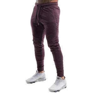 รับผลิตเสื้อผ้ากีฬาผู้ชายแบบขายส่ง ออกแบบโลโก้ OEM กางเกงวิ่งทรงสอบเข้ารูปสำหรับออกกำลังกายและเล่นกีฬา - Product Image 1