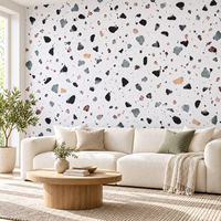 Papier peint MORLENX à motif terrazzo blanc avec des copeaux noirs, gris et pastel pour salon, chambre et café