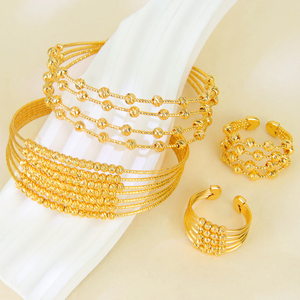 Ensemble de bijoux de mariage tendance plaqué or 21 carats, bracelet et bague multicouches au design dorique pour femme, idéal pour les événements et les fêtes - Product Image 1