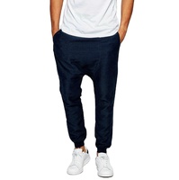 Vente en gros 2025, pantalon de survêtement pour homme, 100% polyester, coupe régulière, taille élastique, entrejambe tombant, respirant, pour l'hiver