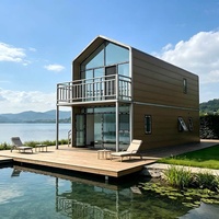 Petit chalet démontable à 2 étages de 50 m² en CLT avec finition bois et véranda