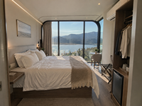 Maisonnette Apple Pod de 40 pieds sur le bord de l'eau, cabane modulaire moderne avec façade entièrement vitrée pour hôtel de marina et complexe de plongée insulaire
