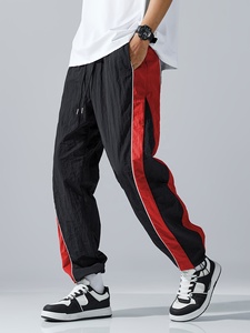 Pantalon de survêtement élégant pour homme, coupe ample et large, avec empiècements contrastants noir et blanc, taille à cordon de serrage, confortable pour le quotidien - Product Image 5