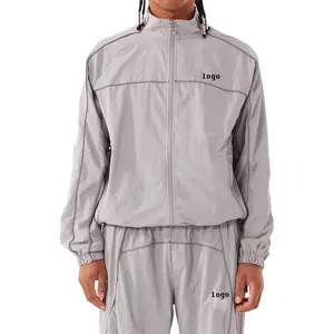 Ensemble de survêtements coupe-vent en nylon de haute qualité Survêtement de sport avec passepoil personnalisé pour hommes