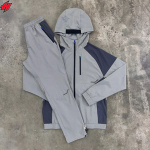 Chándal cortavientos en blanco con diseño de logotipo personalizado OEM del fabricante al por mayor, chándales de nailon, conjuntos de chaqueta y pantalones de dos piezas - Product Image 1