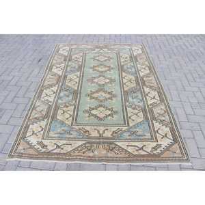 Tapis vintage 5,2 x 7,4 pieds, tapis turc, tapis floral bleu et marron - Product Image 1