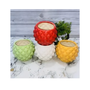 Maceta de cerámica con patrones decorativos y colores ricos perfecta para mostrar sus plantas favoritas con estilo y comodidad - Product Image 1