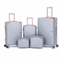 Ensemble de bagages de luxe en ABS à coque rigide avec logo personnalisé OEM, 5 pièces, valise de voyage légère à roulettes lisses avec serrure intelligente en aluminium