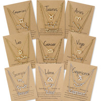 Vente flash Mode 3 pièces Symbole Ciel étoilé Lettre anglaise Argent Or 12 Bijoux du zodiaque Ensemble de colliers pour femme avec papier