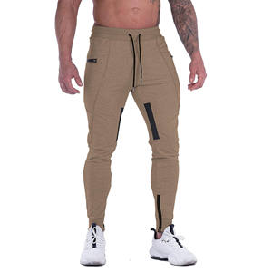Pantalons pour hommes en gros Pantalons décontractés en tricot pour hommes avec poches zippées Pantalons de jogging personnalisés de couleur unie Pantalons pour hommes de grande taille - Product Image 1